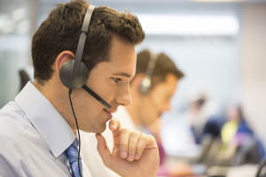 Call center team at office on the phone with headset